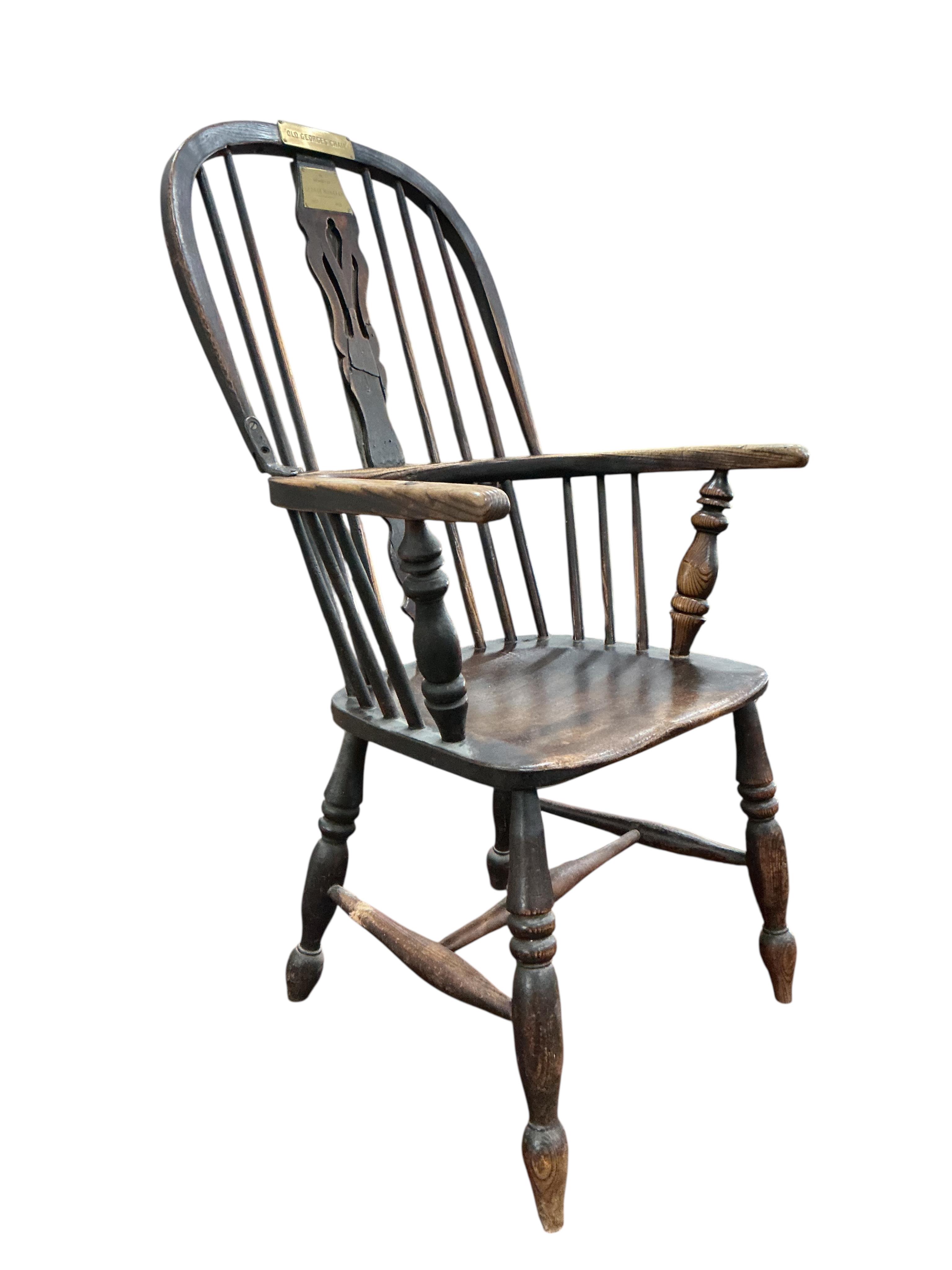 A Victorian ash and elm Windsor armchair, with brass commemorative plaques 'Old George's Chair', width 56cm, depth 46cm, height 102cm